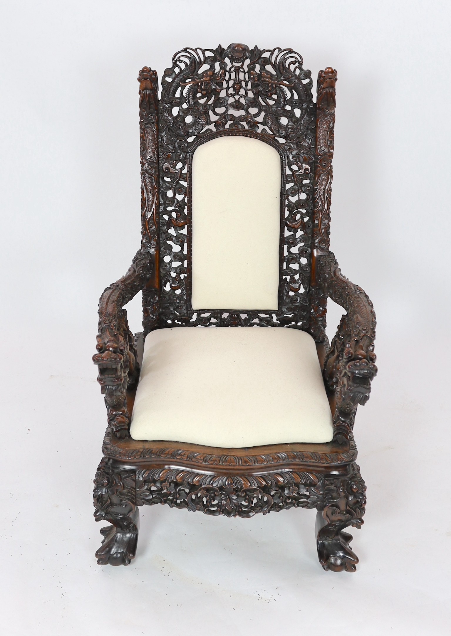 A good Chinese hardwood ‘dragon’ throne armchair, c.1900, 114.5cm high, 68cm wide at the arms